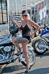 photo:  Woman standing by bike